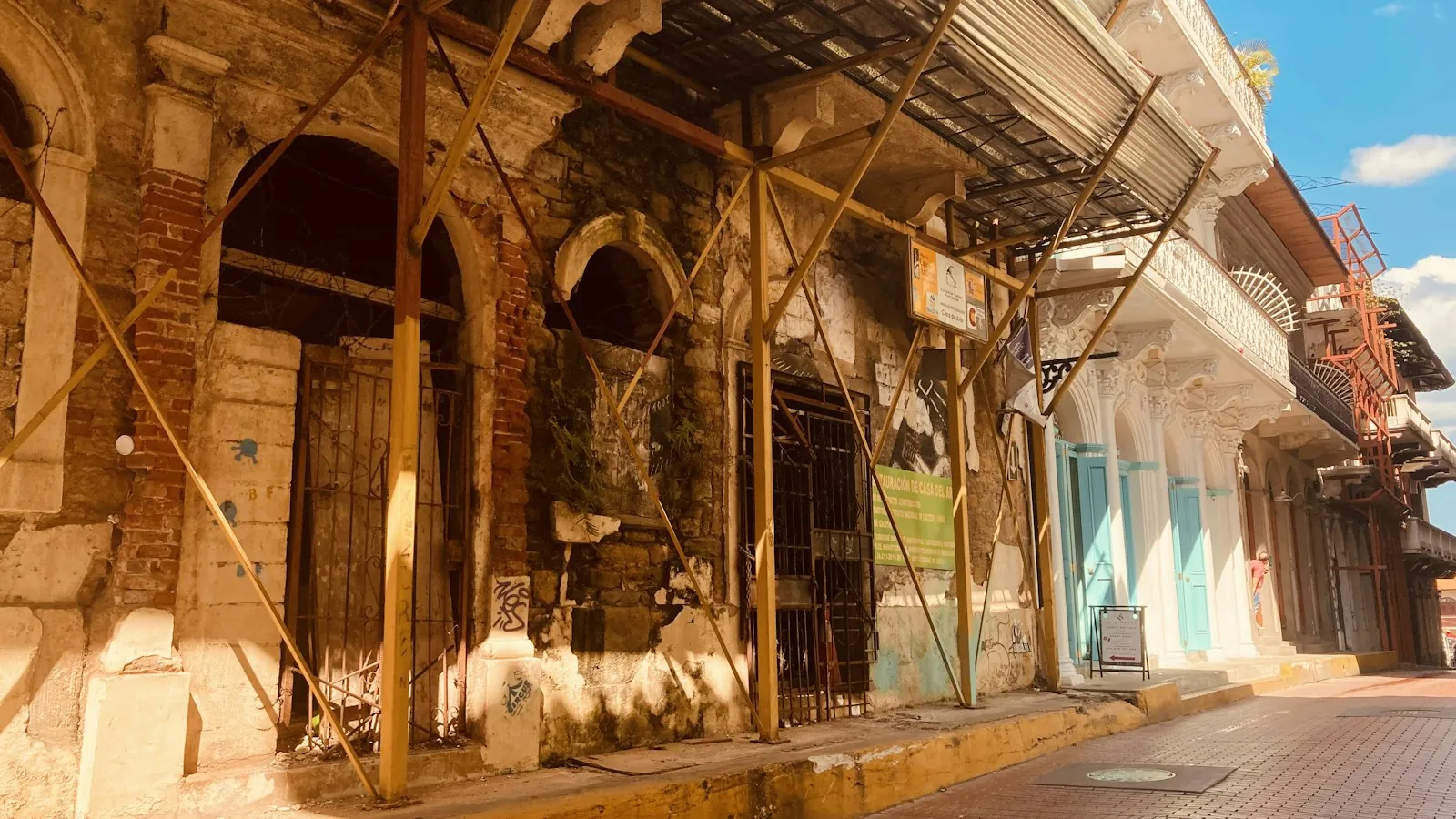 Old arcaded building on a street in Casco Viejo, Panama City